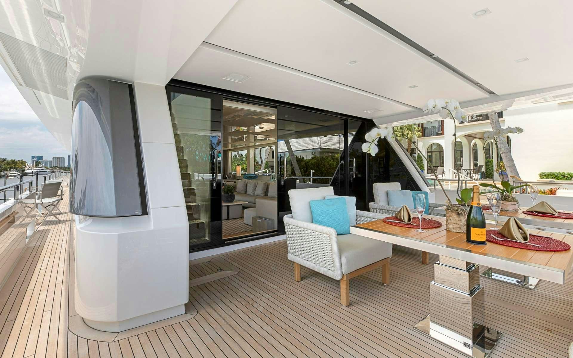 a room with a table and chairs aboard NOTORIOUS Yacht for Charter