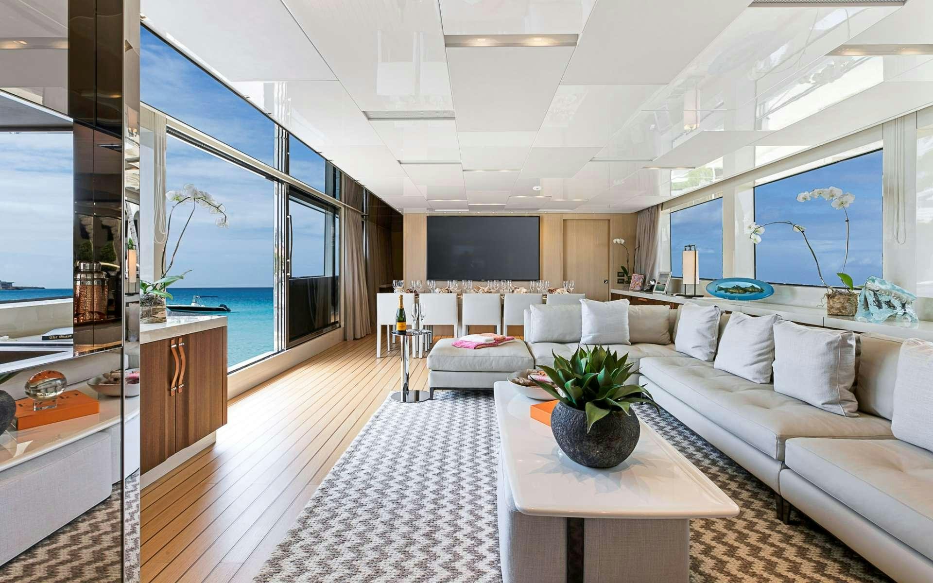 a living room with a large window aboard NOTORIOUS Yacht for Charter