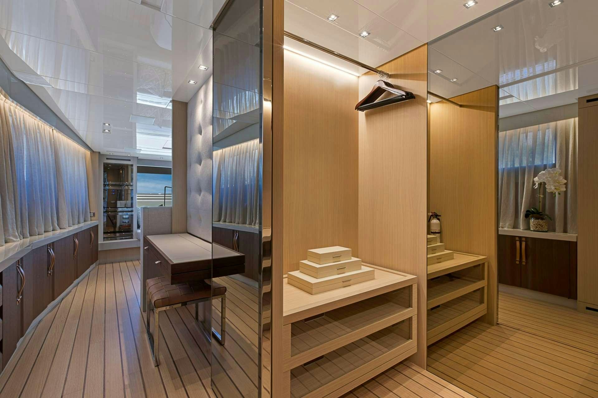 a room with a wood staircase and a wood floor aboard NOTORIOUS Yacht for Charter