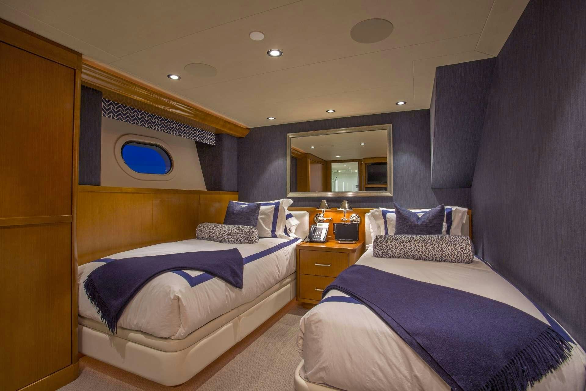a room with two beds aboard FAR NIENTE Yacht for Charter