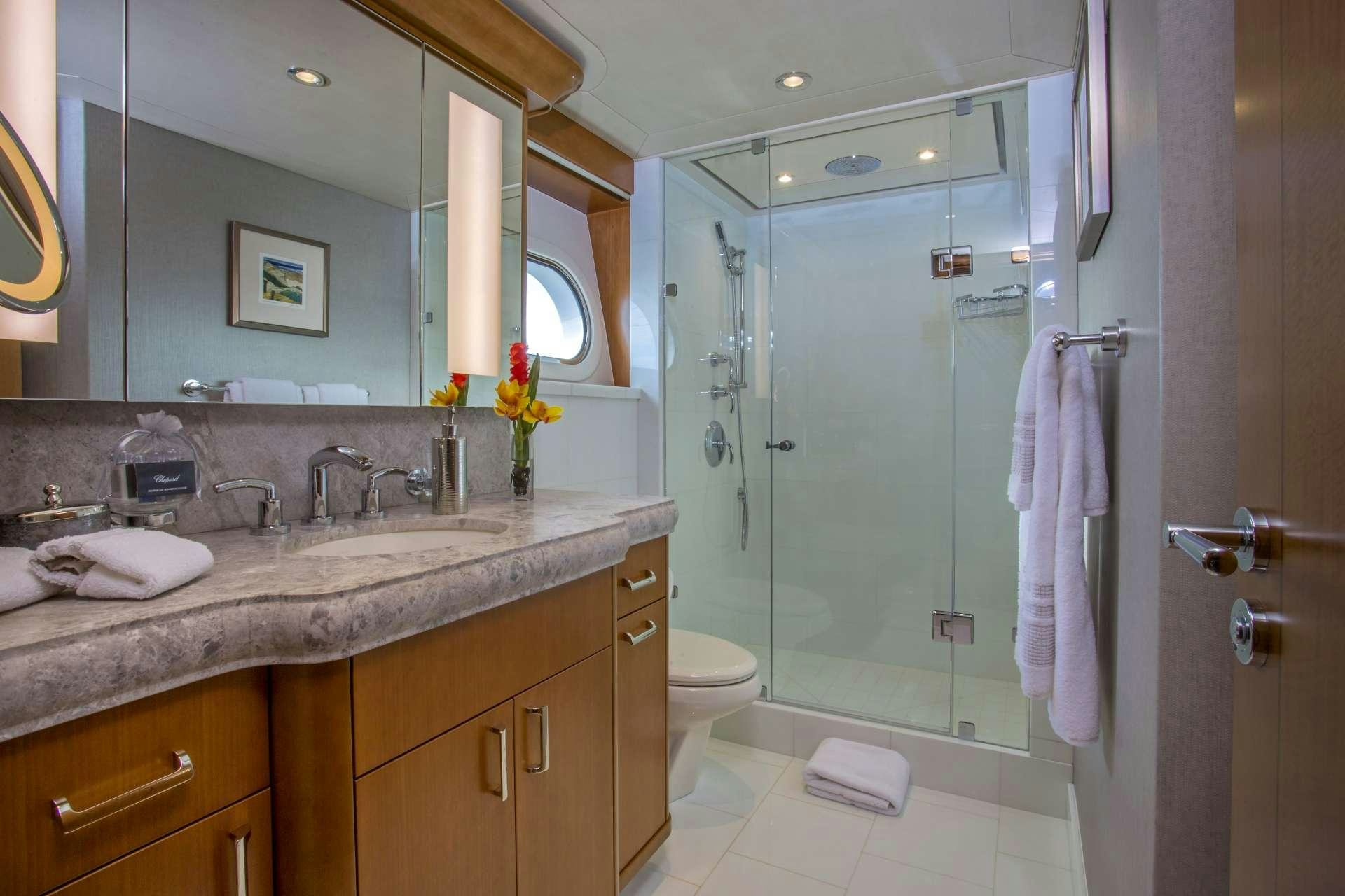 a bathroom with a shower and sink aboard FAR NIENTE Yacht for Charter