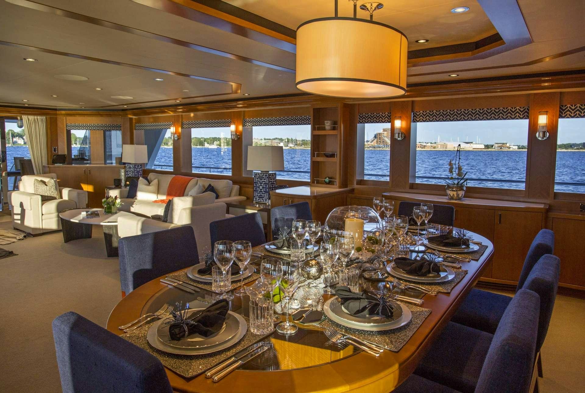 a large dining room with a large table and chairs aboard FAR NIENTE Yacht for Charter