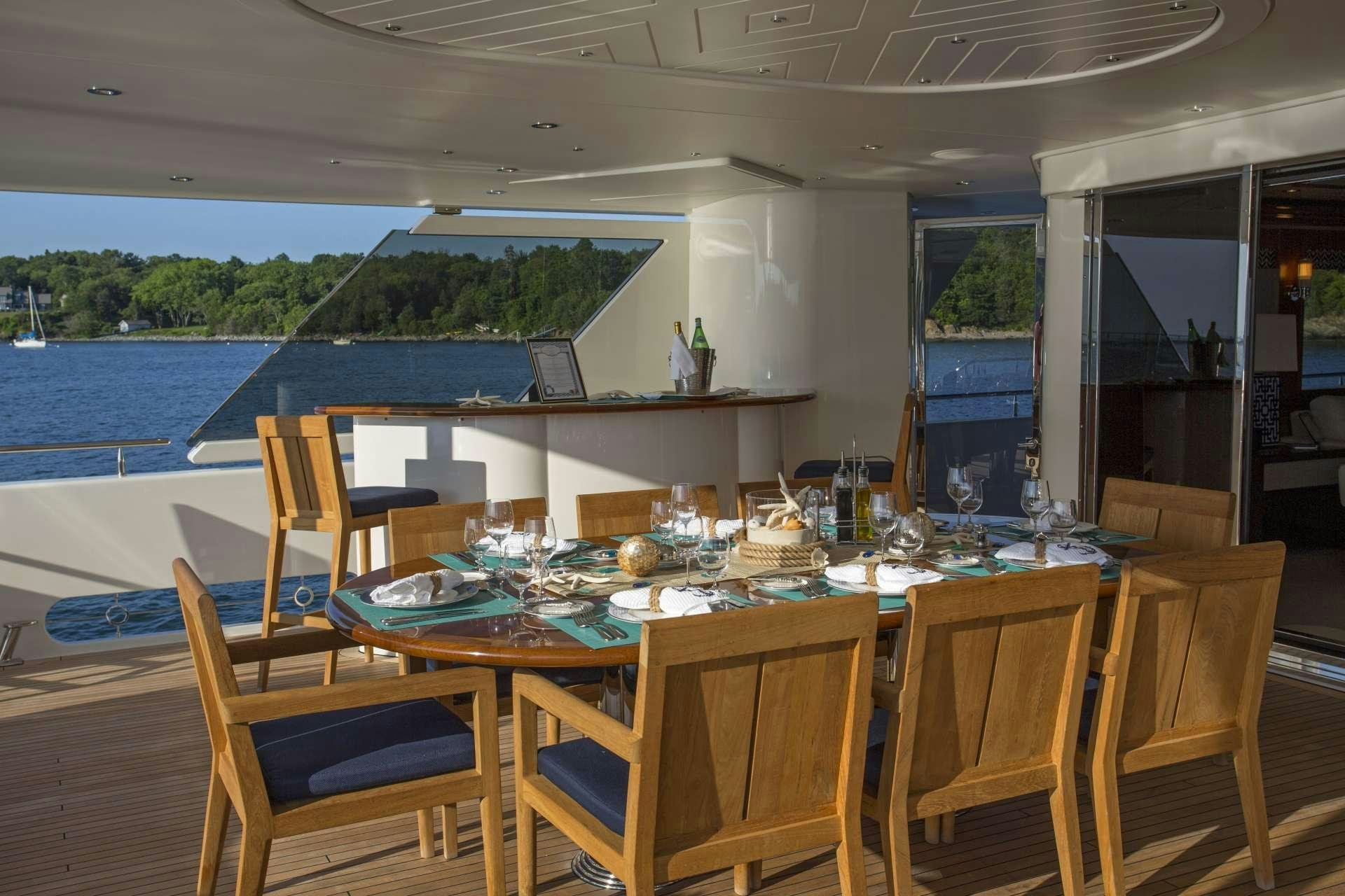 a dining table on a deck aboard FAR NIENTE Yacht for Charter