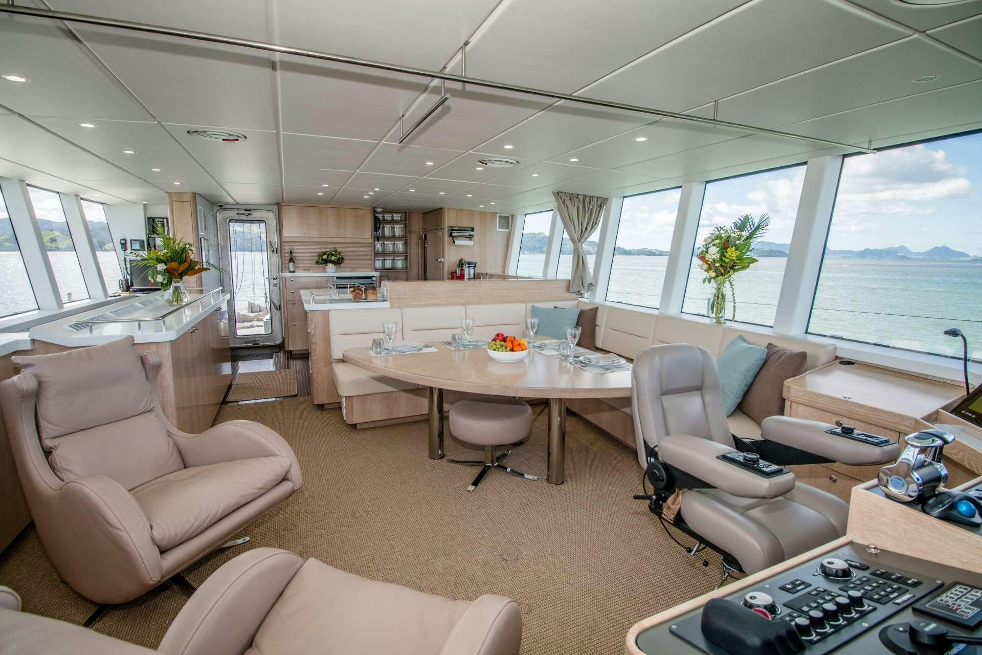 a living room with a large window aboard GREY WOLF Yacht for Charter