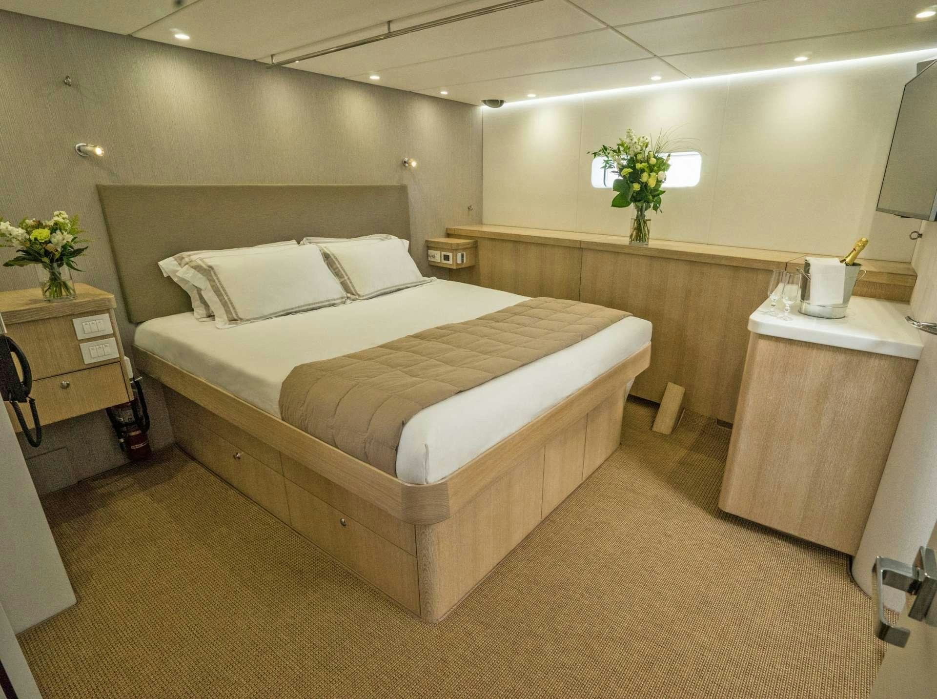 a hotel room with a bed aboard GREY WOLF Yacht for Charter