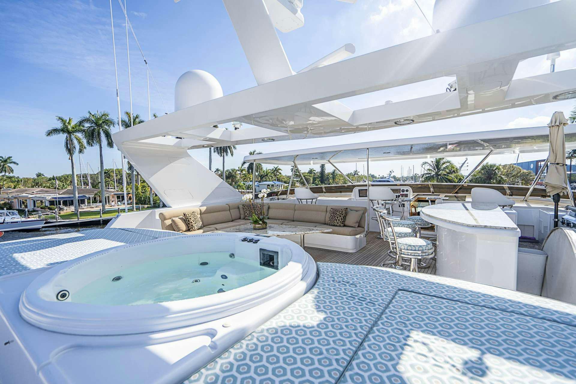 a large white building with a swimming pool aboard REFLECTIONS Yacht for Charter