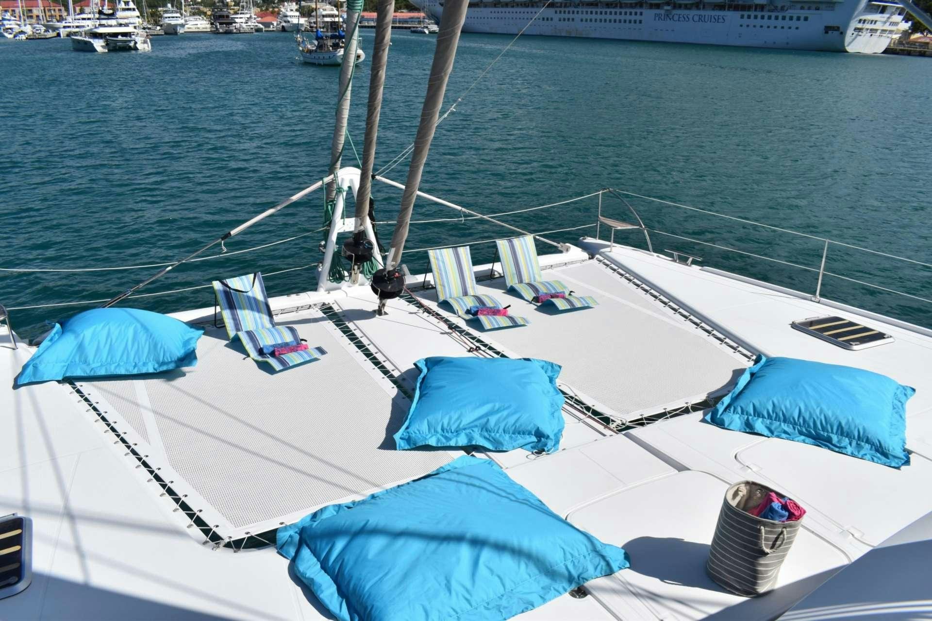 a boat with blue umbrellas on it aboard LIR Yacht for Charter