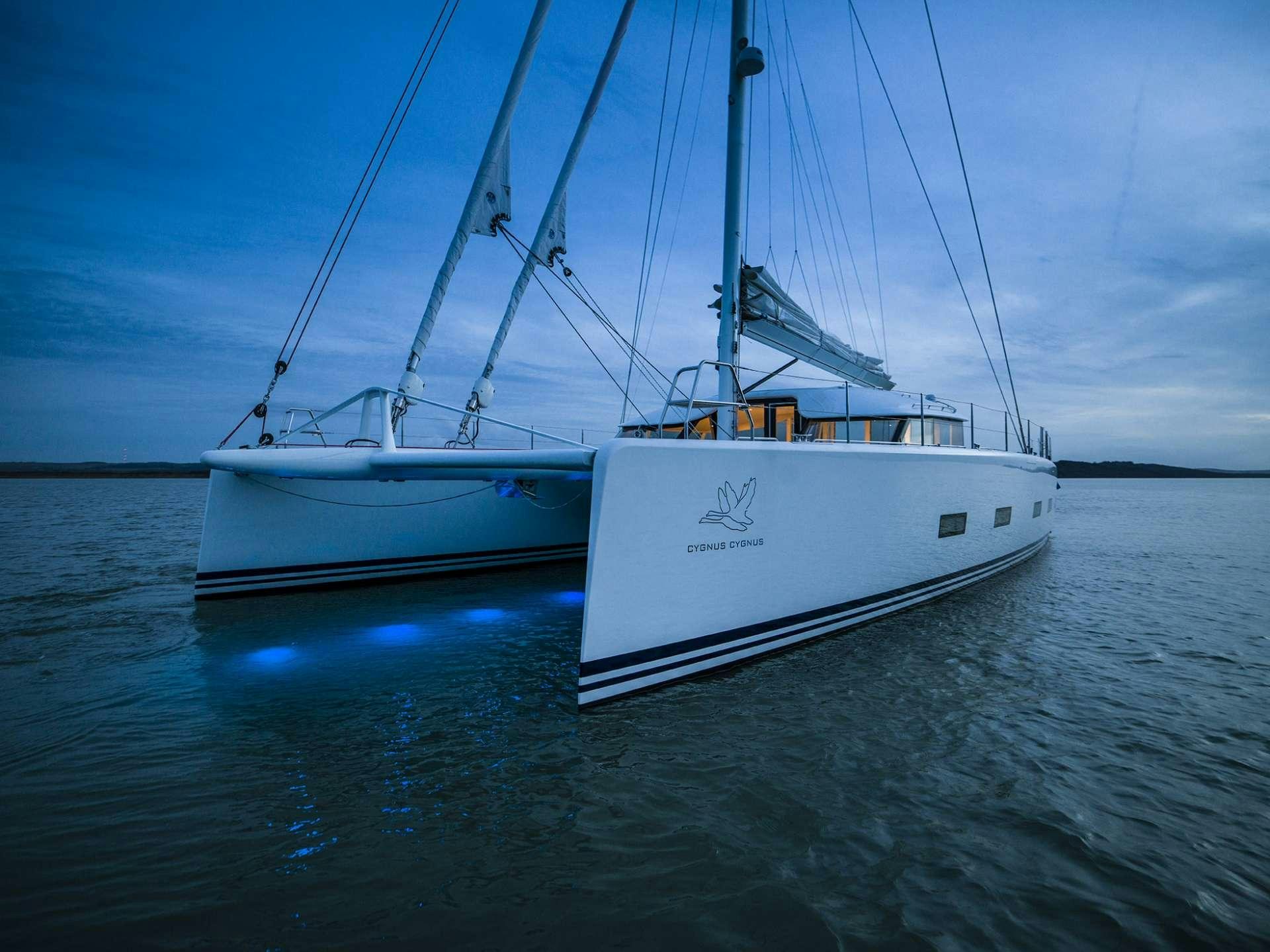 a couple of boats in the water aboard CYGNUS CYGNUS Yacht for Charter