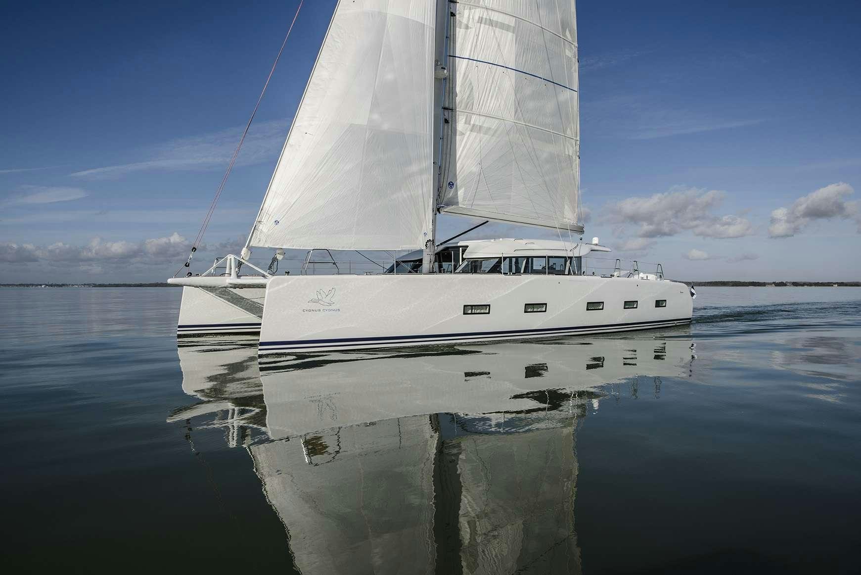 a white boat on the water aboard CYGNUS CYGNUS Yacht for Charter