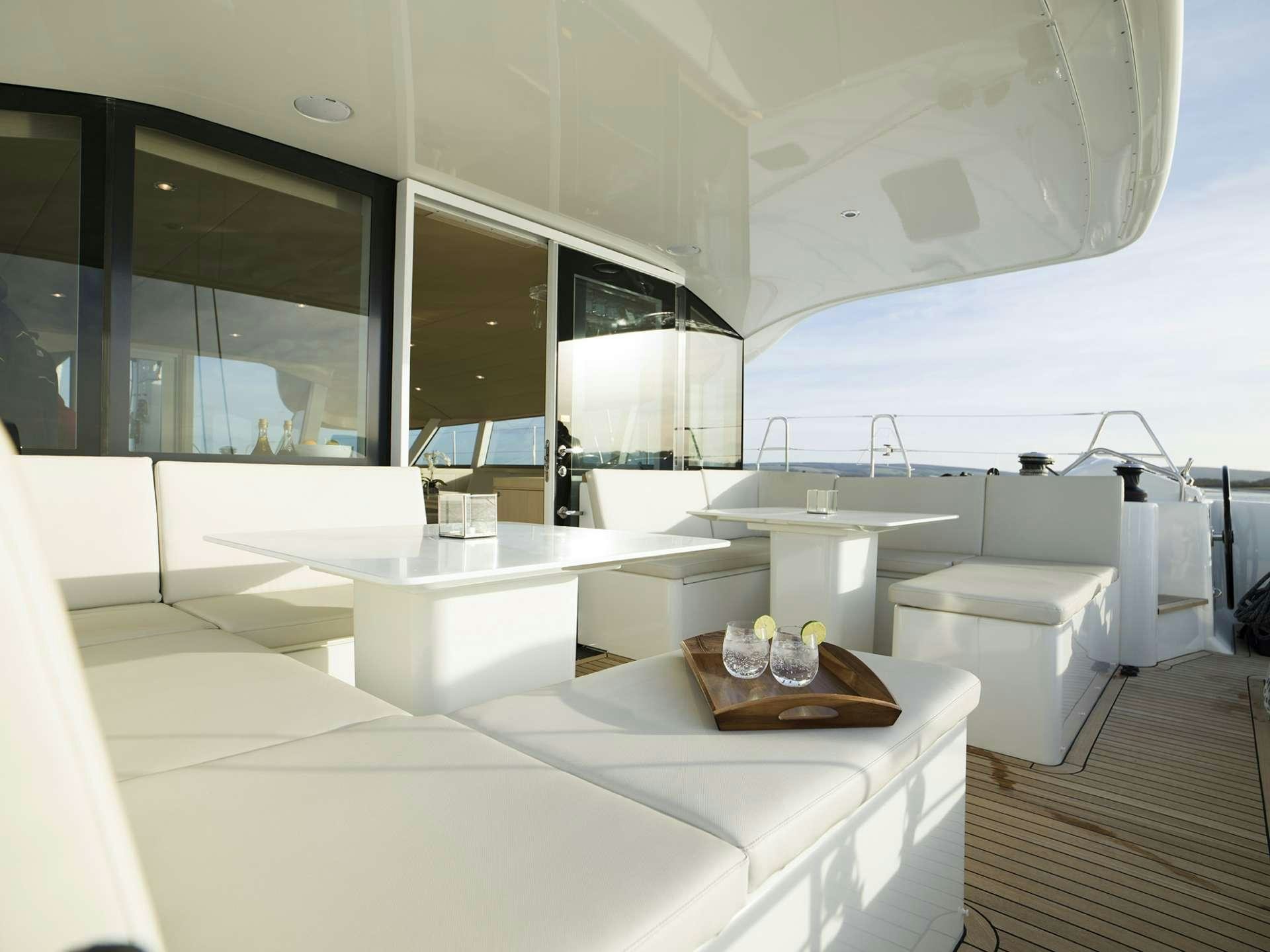 a room with a large white bed aboard CYGNUS CYGNUS Yacht for Charter