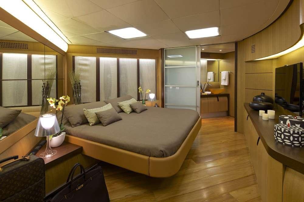 a large bedroom with a large bed aboard SOLARIS Yacht for Charter
