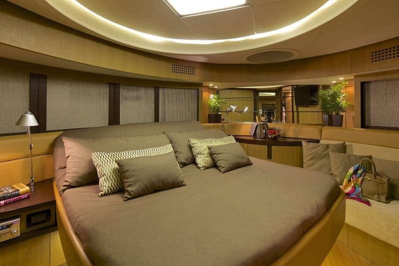a large living room with a large couch and a table aboard SOLARIS Yacht for Charter
