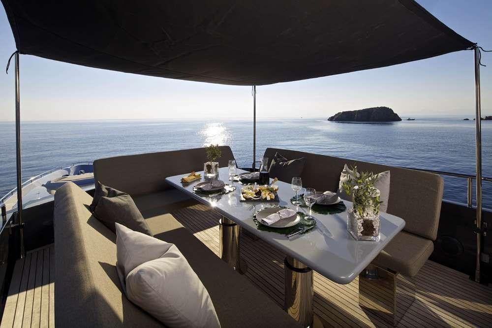 a table with food on it aboard SOLARIS Yacht for Charter