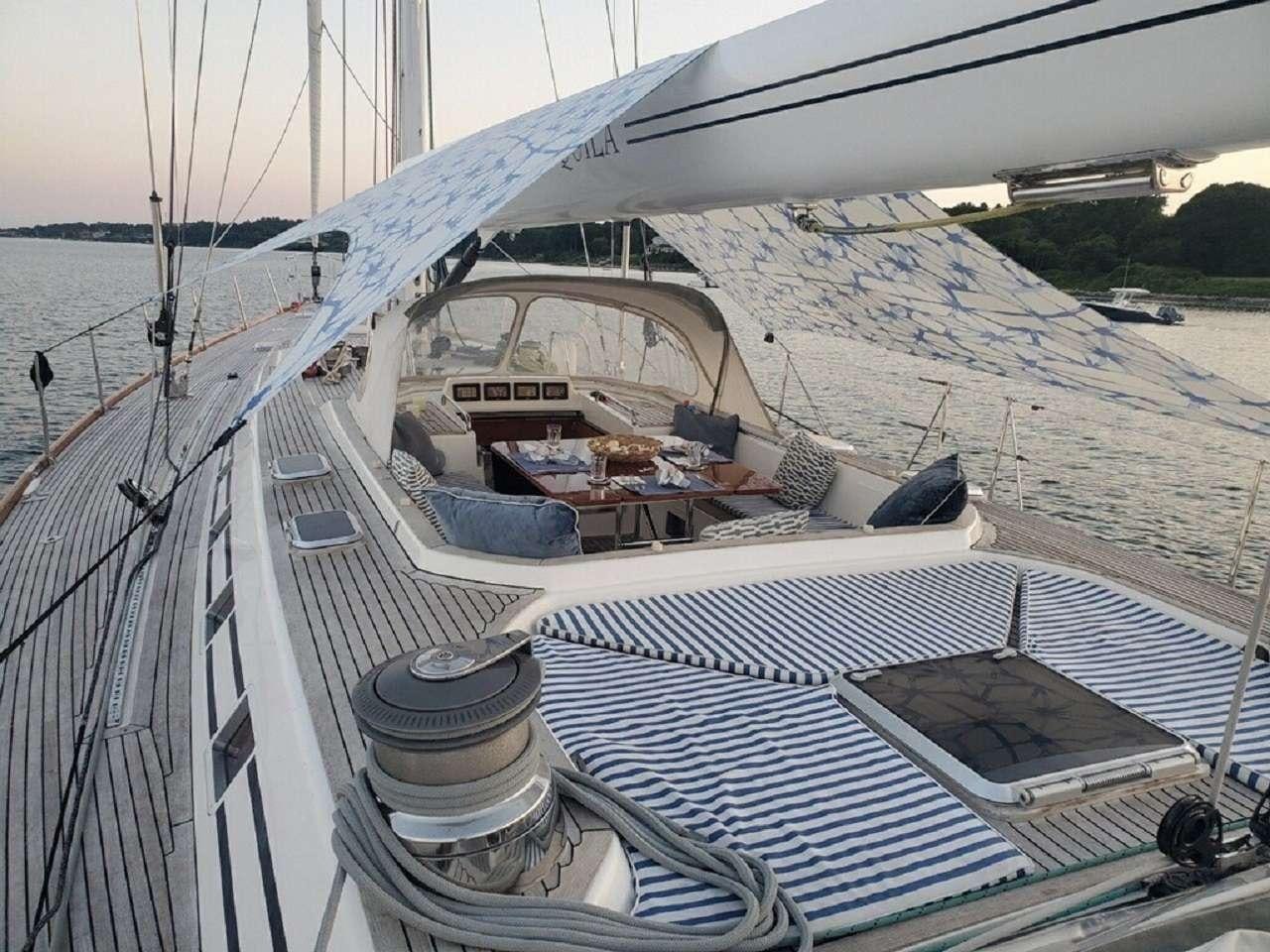 a large ship docked aboard aquila Yacht for Charter