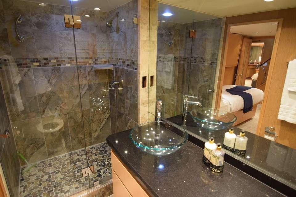 a bathroom with a large glass shower aboard ISLAND VIBES Yacht for Charter