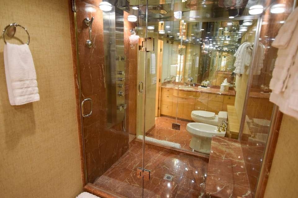 a bathroom with a glass shower aboard ISLAND VIBES Yacht for Charter