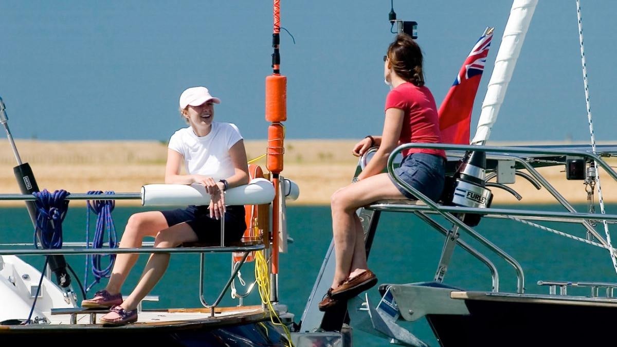 a couple of people on a boat aboard MUSTIQUE Yacht for Charter