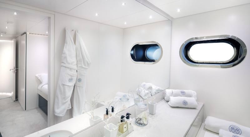 a bathroom with a large mirror aboard OCEAN SAPPHIRE Yacht for Charter