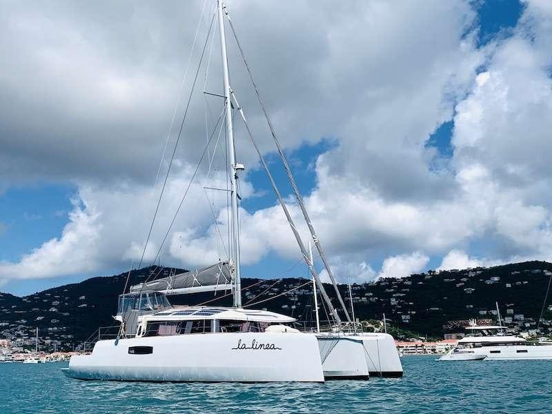 a white boat in the water aboard LA LINEA Yacht for Charter