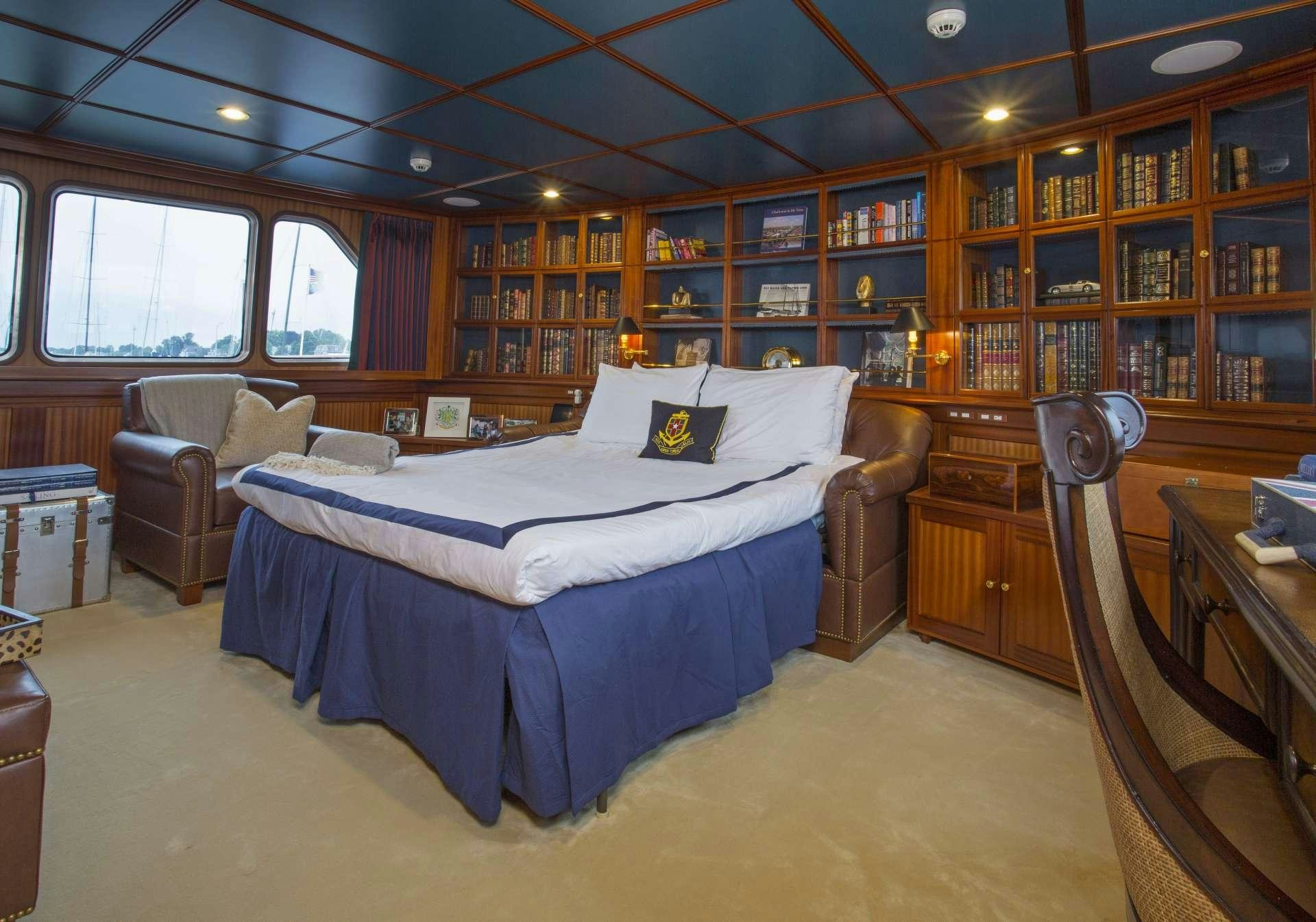 a bedroom with a large bed aboard LADY VICTORIA Yacht for Charter