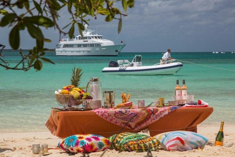 a boat is parked on the beach aboard LADY VICTORIA Yacht for Charter