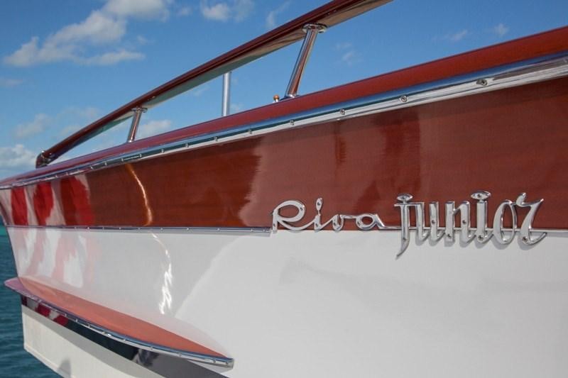a red and white boat aboard LADY VICTORIA Yacht for Charter