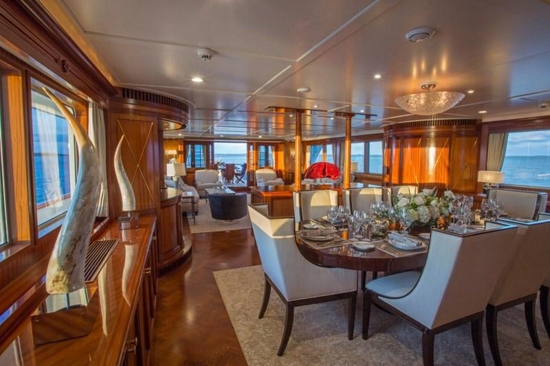 a large dining room with a large table and chairs aboard LADY VICTORIA Yacht for Charter