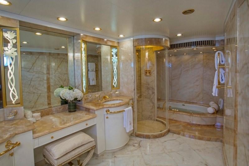 a bathroom with a large mirror aboard LADY VICTORIA Yacht for Charter