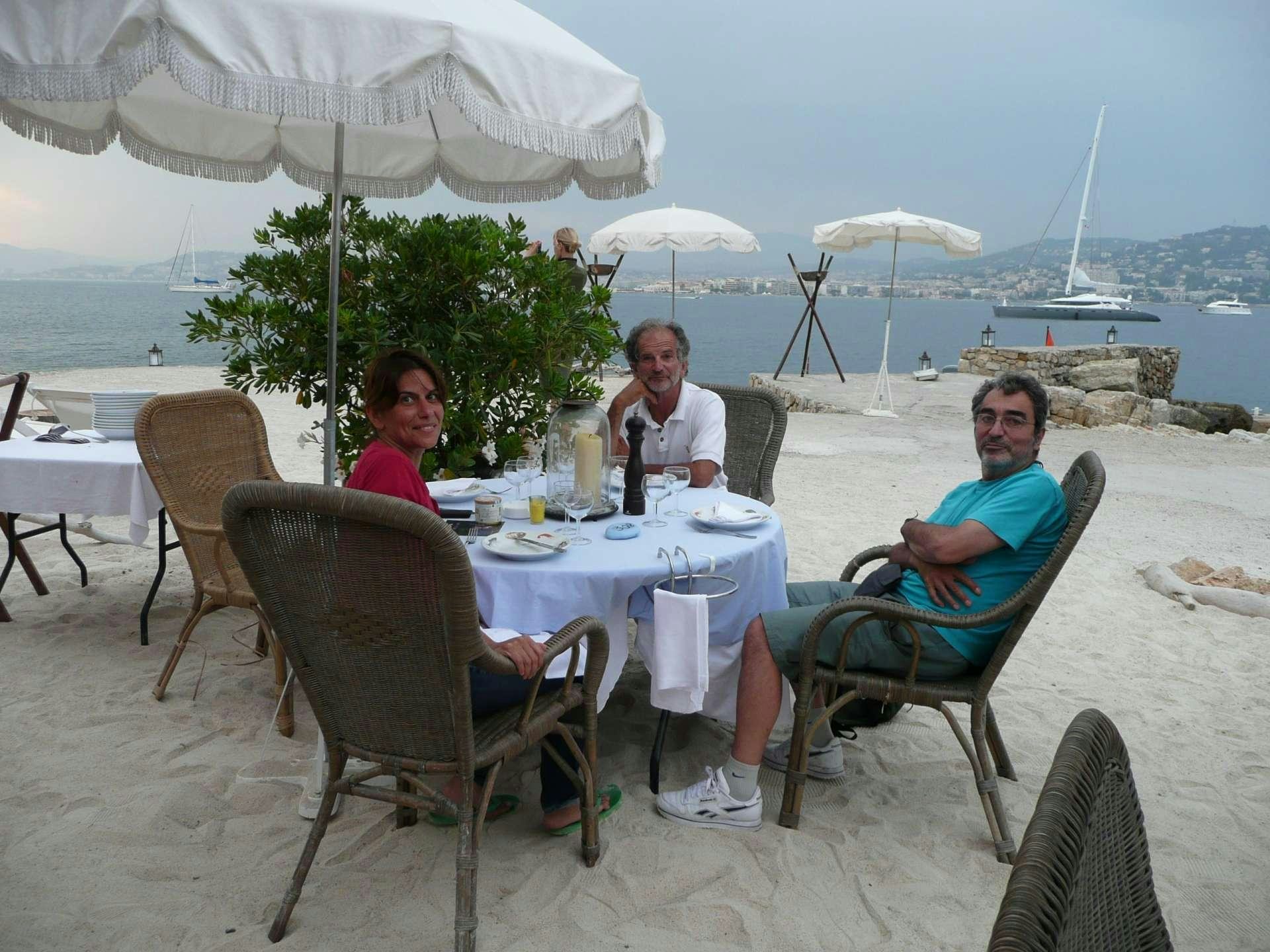 a group of people sitting at a table outside aboard ANAHITA Yacht for Charter
