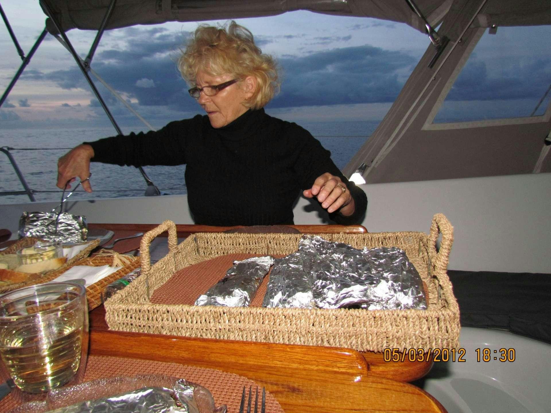 a man preparing food in a tent aboard ANAHITA Yacht for Charter