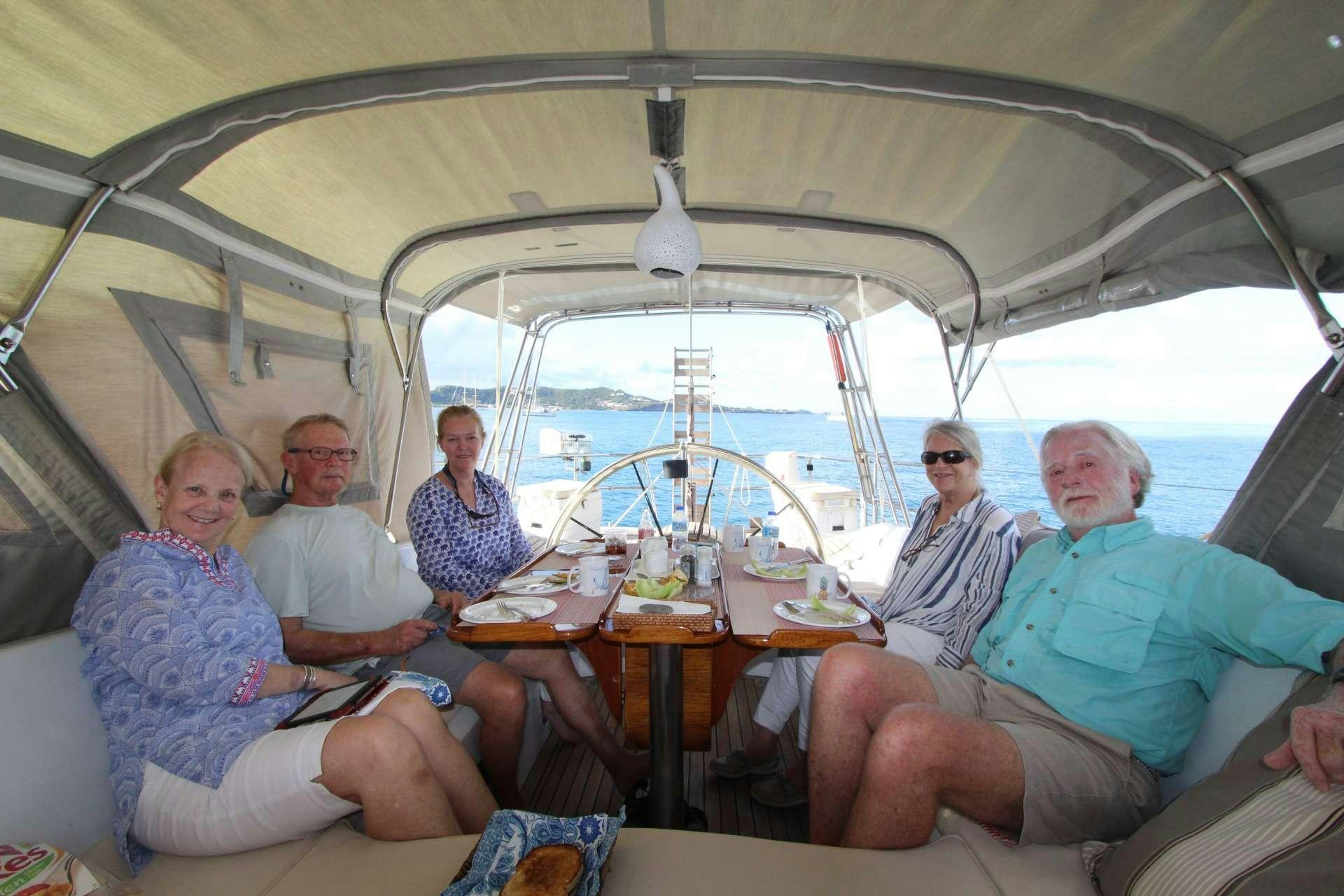 a group of people sitting in a tent aboard ANAHITA Yacht for Charter