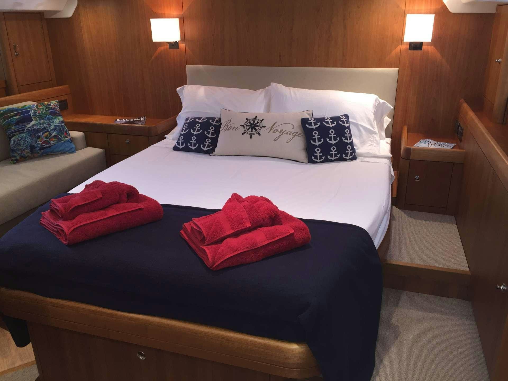 a bed with pillows on it aboard SPIRIT Yacht for Charter