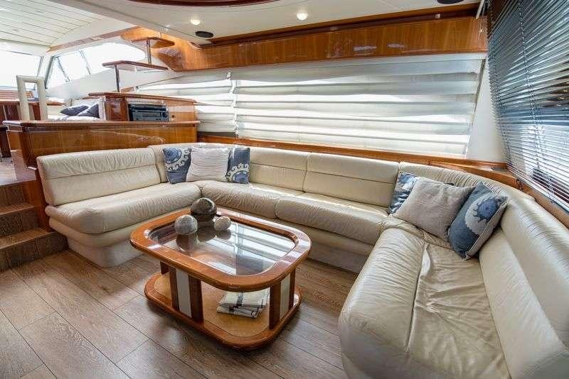 a living room with a couch and a coffee table aboard ANANAS Yacht for Charter