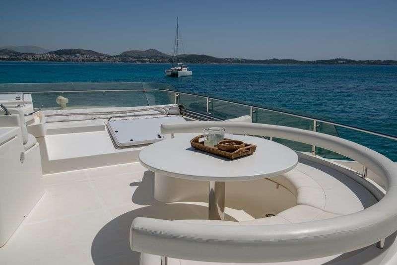 a white boat on a white surface aboard ANANAS Yacht for Charter
