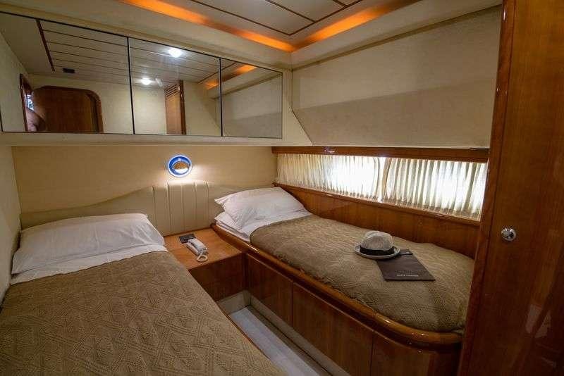 a room with two beds aboard ANANAS Yacht for Charter