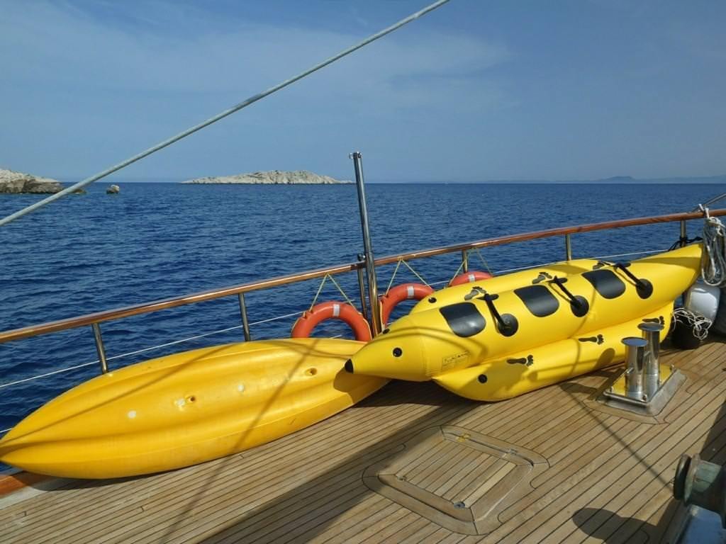 a yellow boat on the water aboard KAPTAN MEHMET BUGRA Yacht for Charter