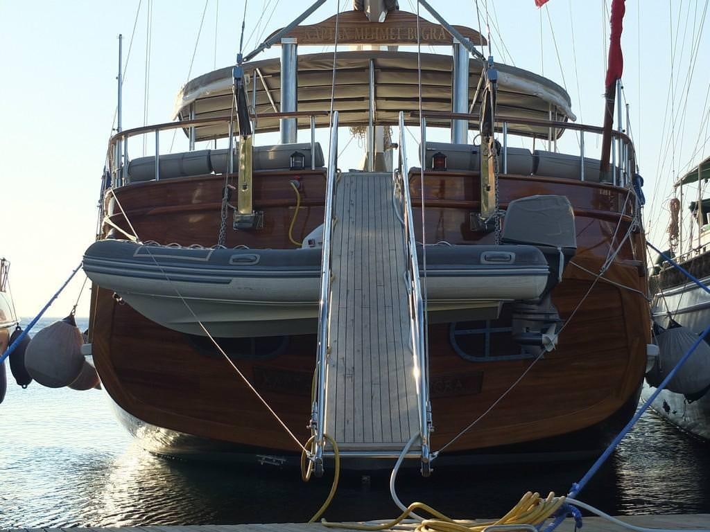 a boat tied to a dock aboard KAPTAN MEHMET BUGRA Yacht for Charter