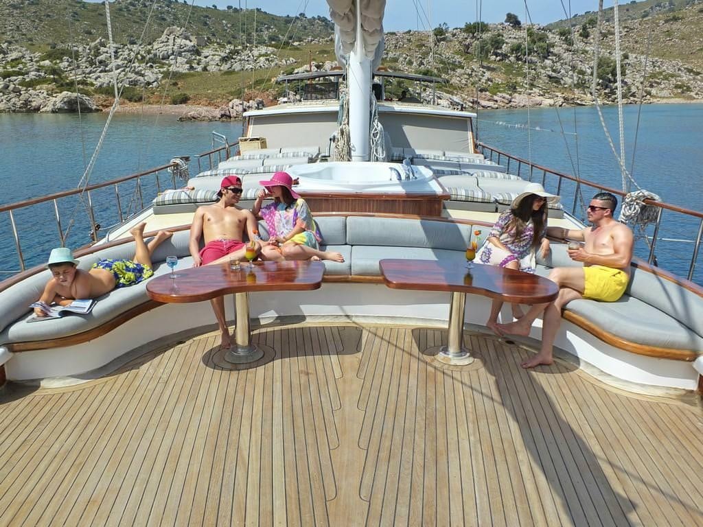 a group of people on a dock aboard KAPTAN MEHMET BUGRA Yacht for Charter