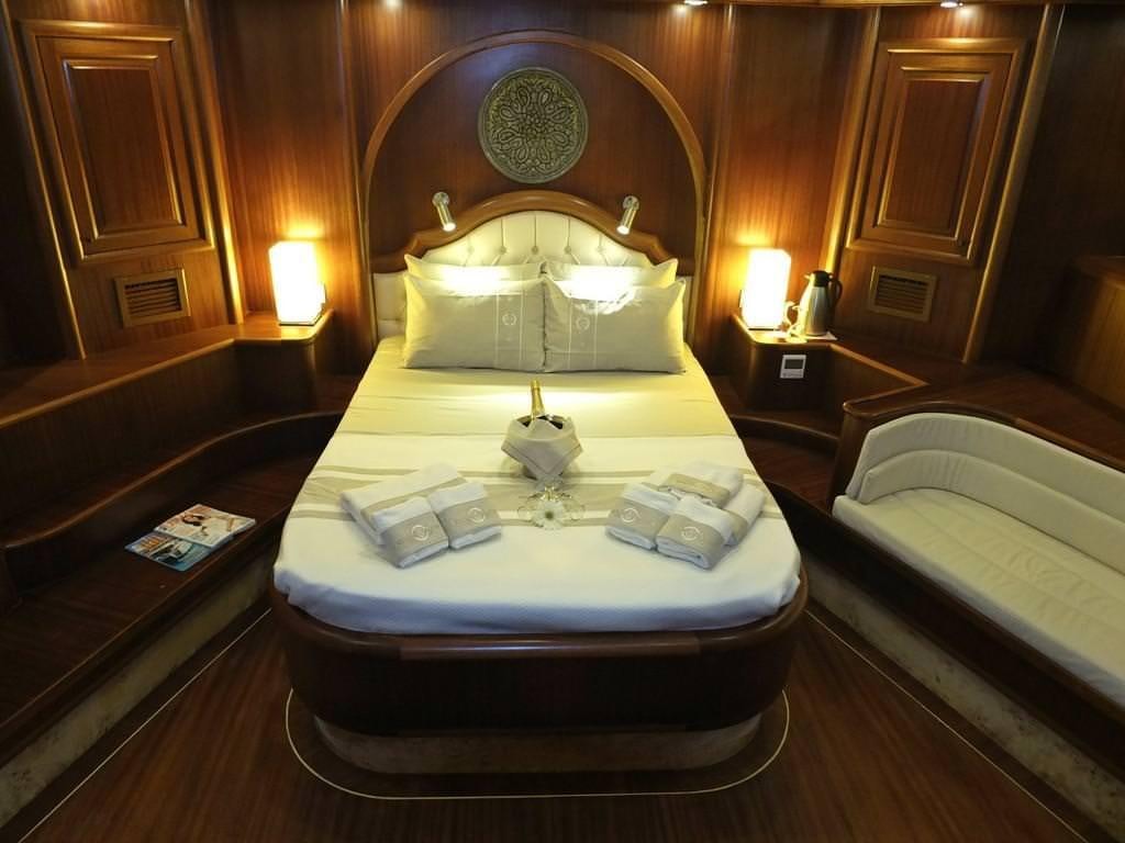 a hotel room with two beds aboard KAPTAN MEHMET BUGRA Yacht for Charter