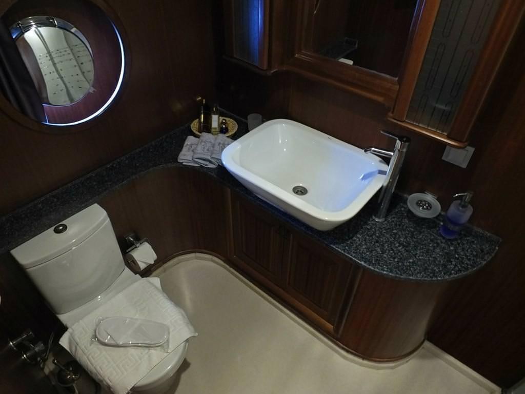 a bathroom with a tub sink and toilet aboard KAPTAN MEHMET BUGRA Yacht for Charter