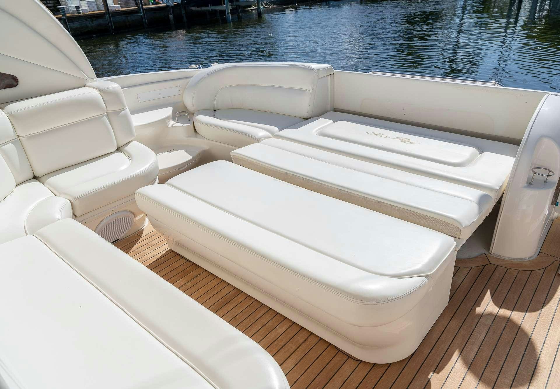 a row of white boats on a dock aboard XOXO Yacht for Charter