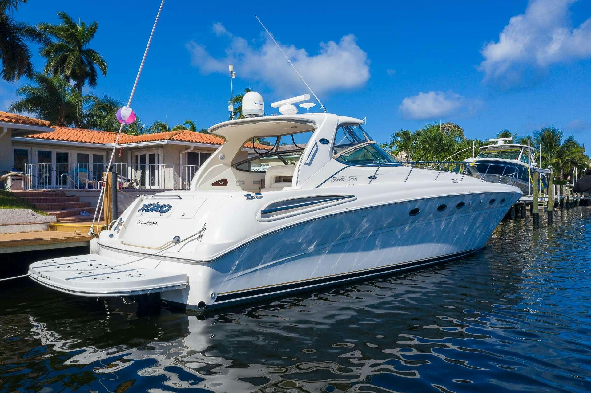 a white boat in the water aboard XOXO Yacht for Charter