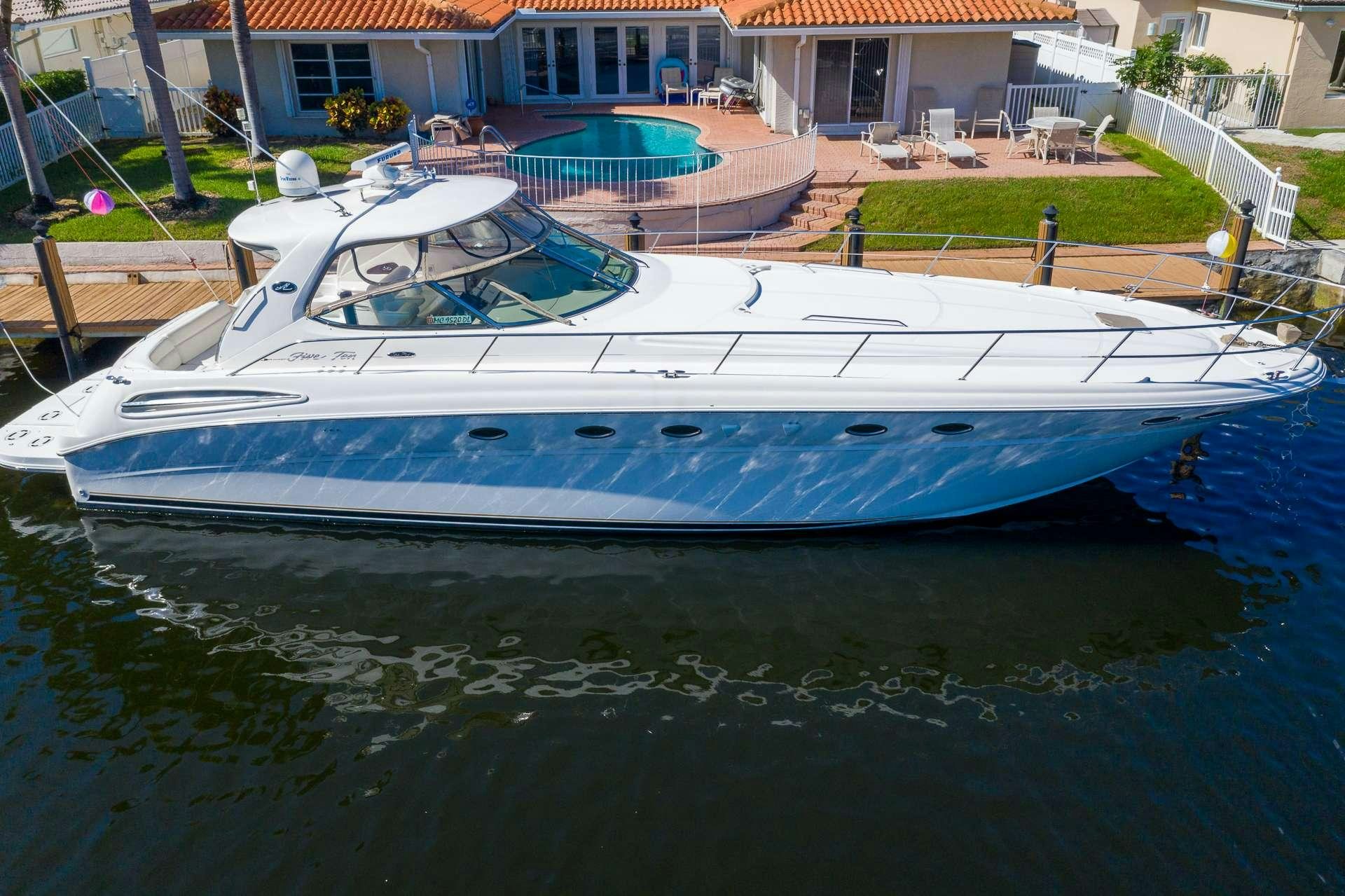 a boat docked at a pier aboard XOXO Yacht for Charter