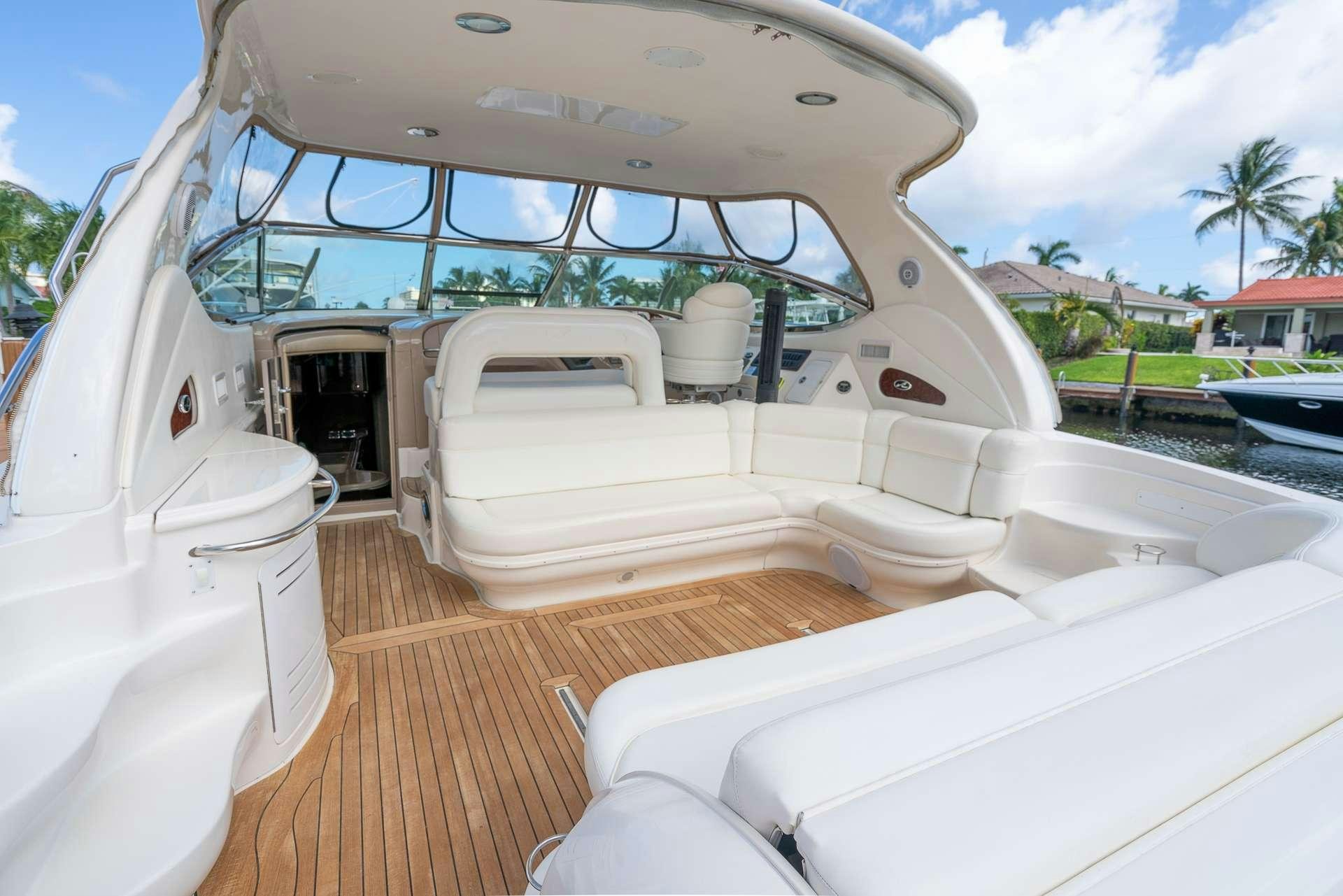 a boat with a large white canopy aboard XOXO Yacht for Charter
