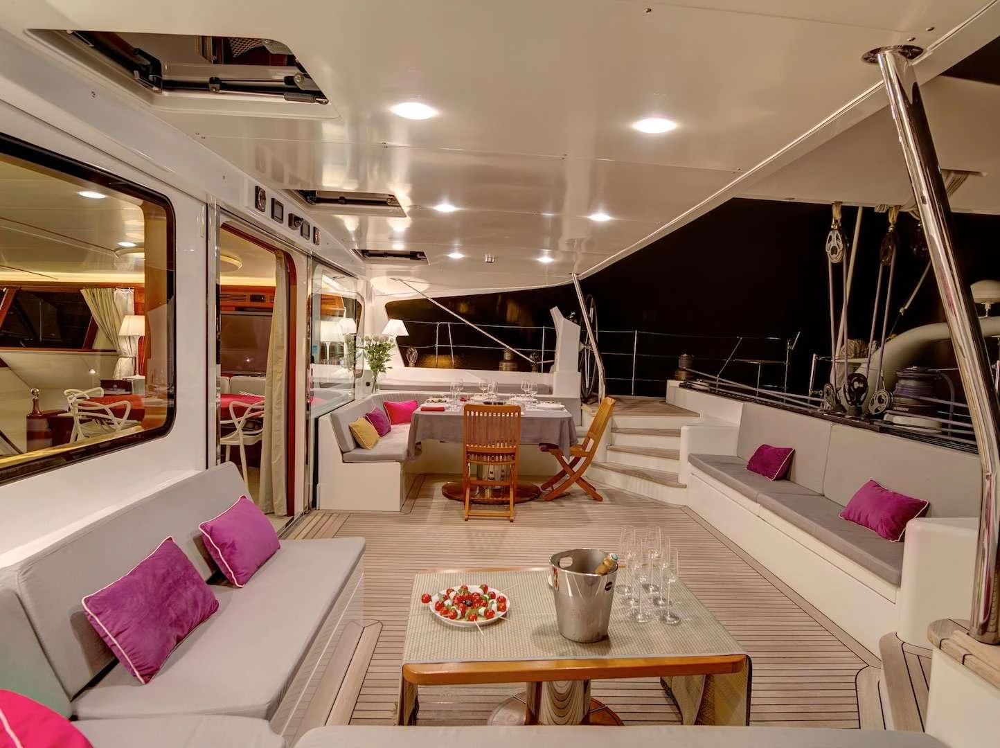 The aft deck offers a luxurious and inviting space with comfortable seating and elegant decor. aboard AZIZAM Yacht for Charter