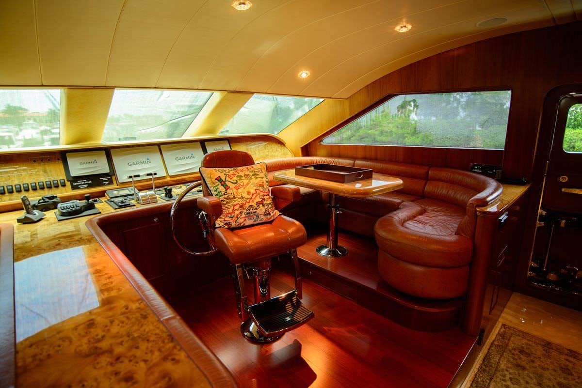 a room with a tv and a table aboard KENTUCKY BELLE Yacht for Charter