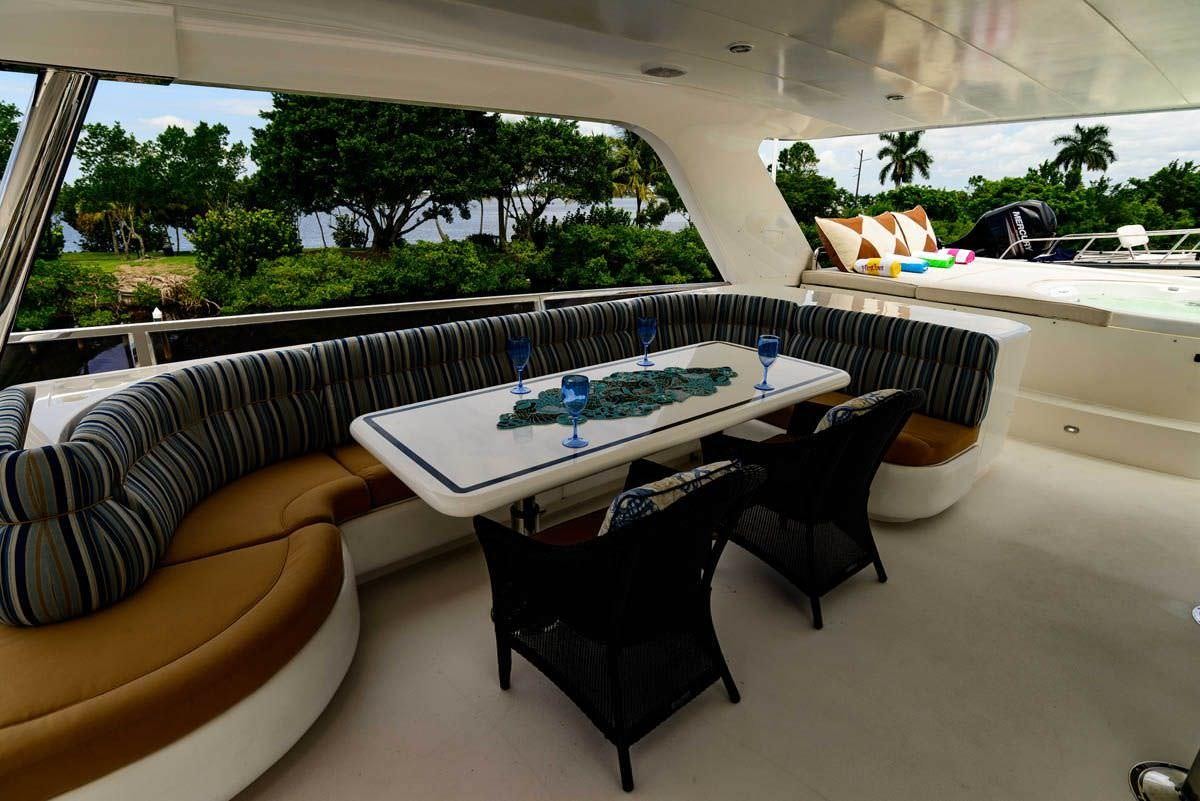 a table and chairs in a room aboard KENTUCKY BELLE Yacht for Charter