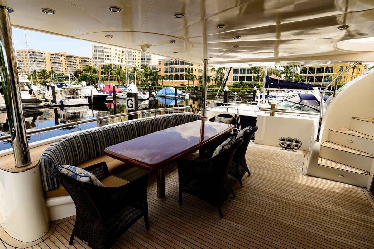 a room with a table and chairs aboard KENTUCKY BELLE Yacht for Charter