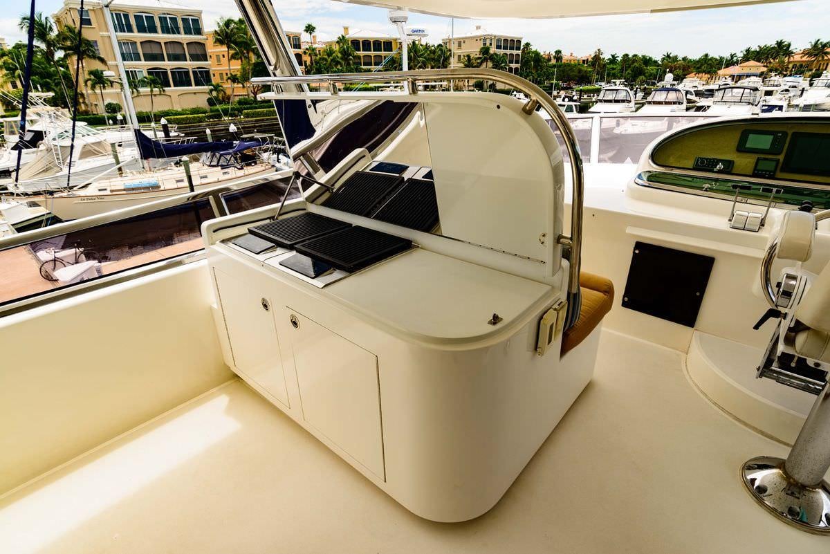 a white boat on a deck aboard KENTUCKY BELLE Yacht for Charter