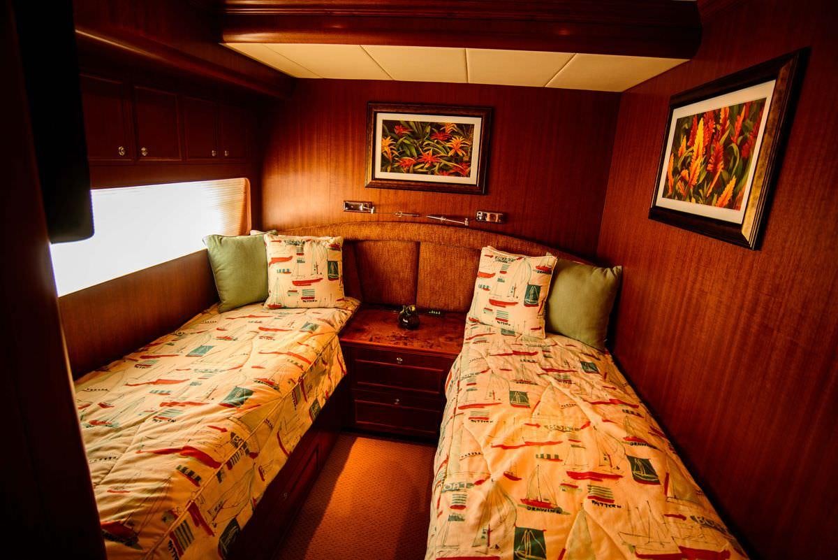 a room with two beds aboard KENTUCKY BELLE Yacht for Charter